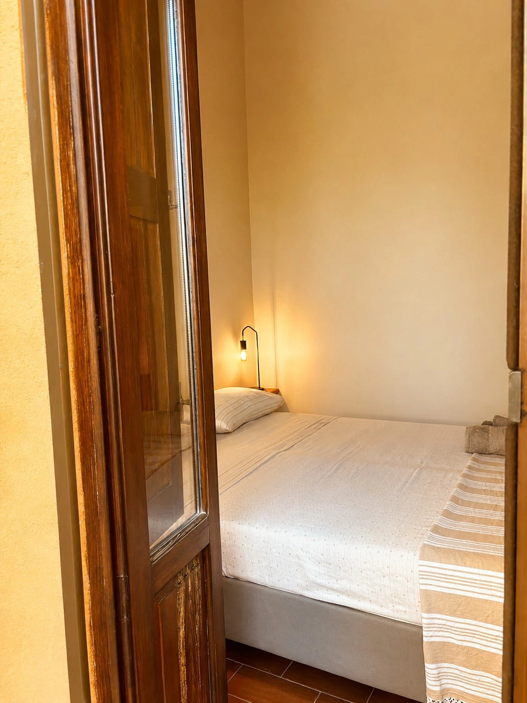 Camera da letto di Casa Pompelmo vista dal balcone